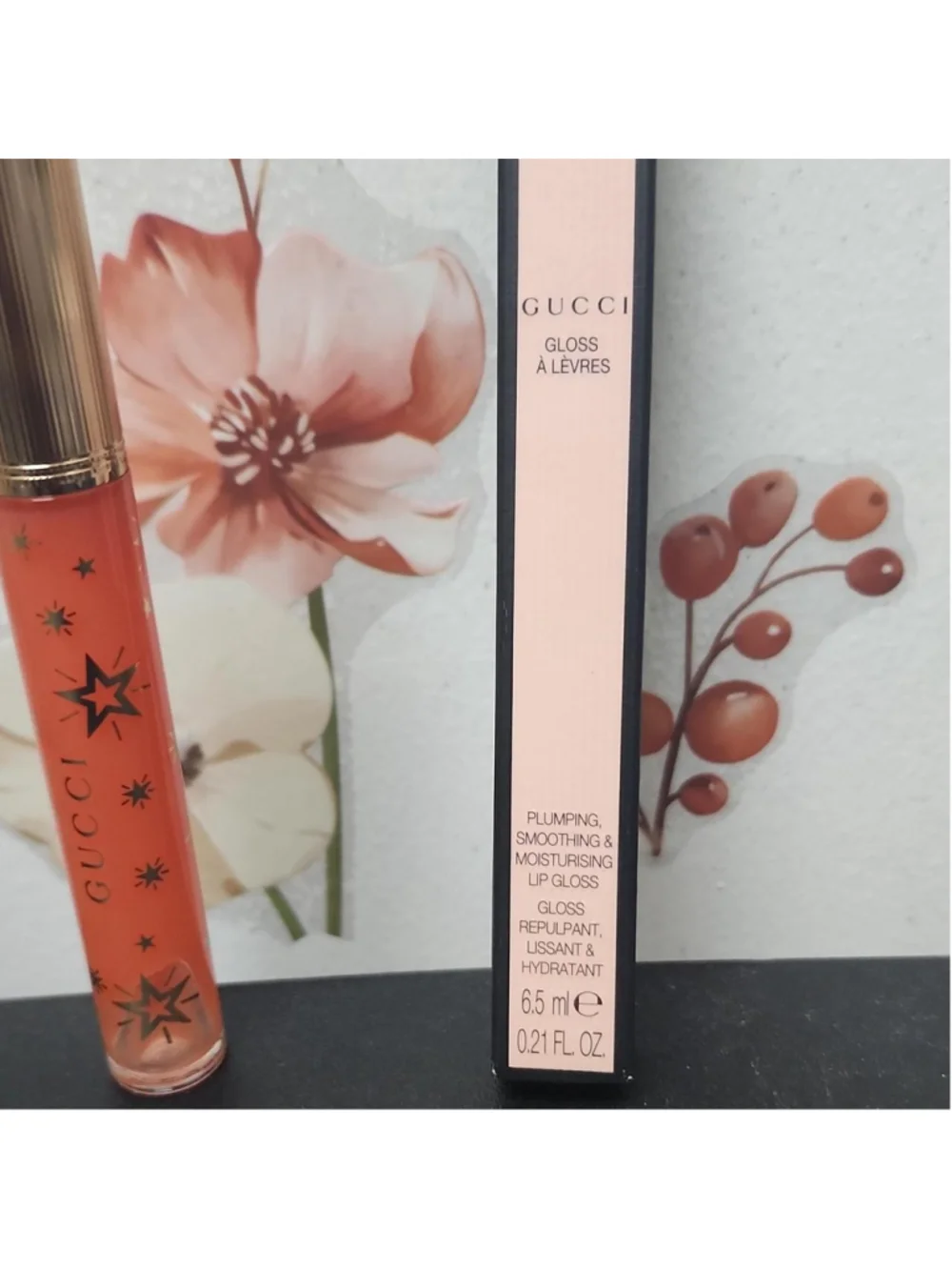 Gucci lip gloss in shade 314 Sade Coral